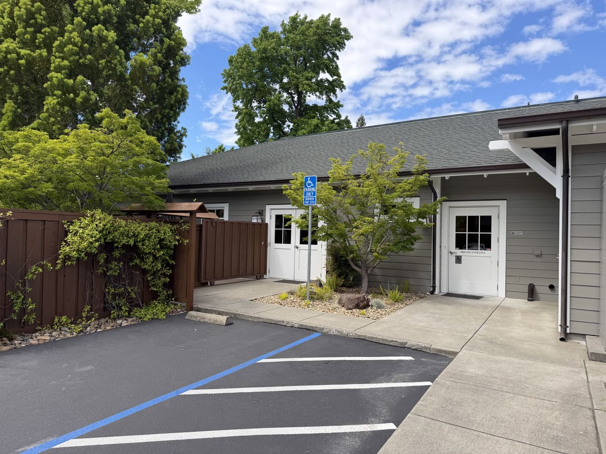 outside of a building with door and parking
